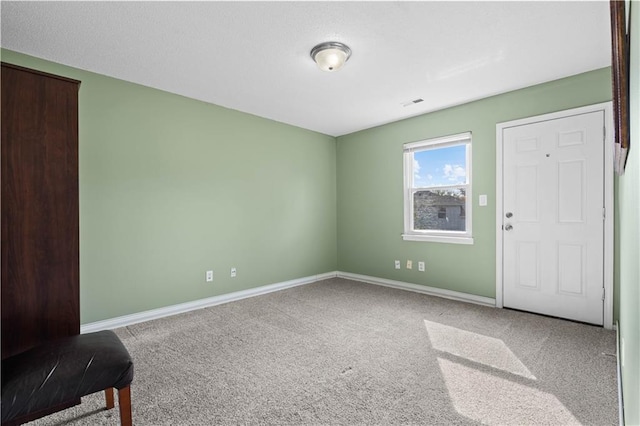 spare room with carpet flooring