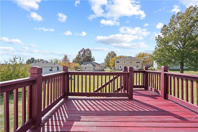 wooden terrace with a yard