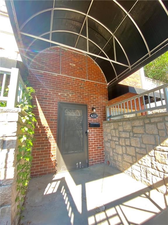 property entrance with a patio area