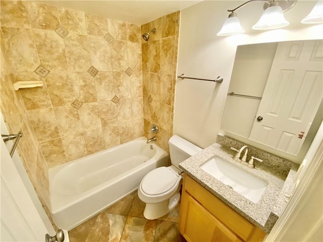 full bathroom with vanity, toilet, and tiled shower / bath combo