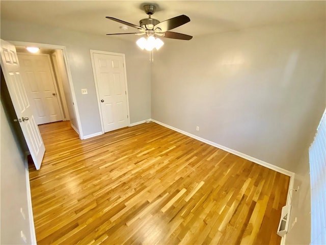 unfurnished bedroom with ceiling fan and light hardwood / wood-style flooring