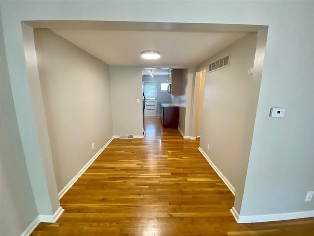 corridor featuring light hardwood / wood-style floors