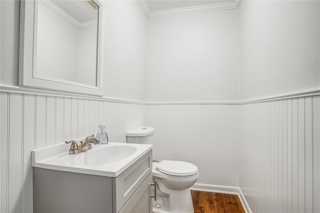 403 S Jackson St, Archie, MO 64725 - bathroom with vanity, wood finished floors, crown molding, and wainscoting