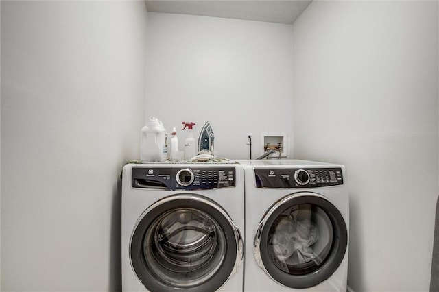 403 S Jackson St, Archie, MO 64725 - laundry room featuring washing machine and clothes dryer