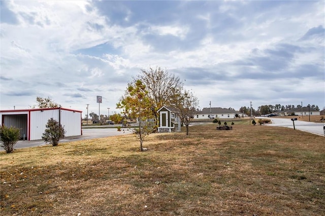 403 S Jackson St, Archie, MO 64725 - view of green lawn featuring an outdoor structure