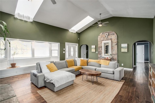 403 S Jackson St, Archie, MO 64725 - living room with ceiling fan, arched walkways, high vaulted ceiling, and wood-type flooring