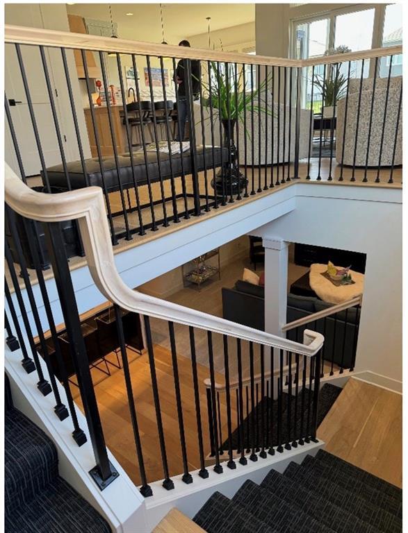 stairway with wood finished floors