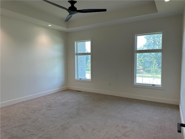 2846 W 133rd Ter, Leawood, KS 66209 - empty room with a tray ceiling, baseboards, carpet, ceiling fan, and recessed lighting