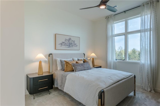 2846 W 133rd Ter, Leawood, KS 66209 - bedroom with multiple windows, light carpet, baseboards, and a ceiling fan