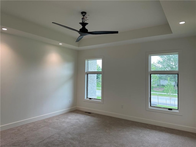 2846 W 133rd Ter, Leawood, KS 66209 - carpeted spare room featuring a tray ceiling, a ceiling fan, and recessed lighting