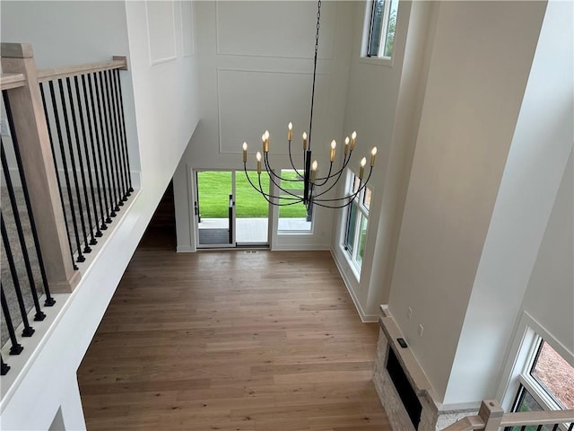 2846 W 133rd Ter, Leawood, KS 66209 - foyer with wood finished floors, a chandelier, and plenty of natural light