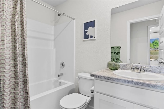 full bathroom featuring vanity, toilet, and shower / tub combo with curtain