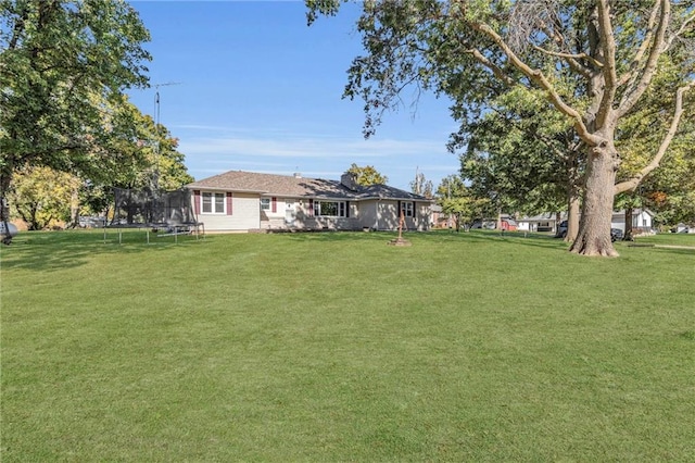 view of yard with a trampoline