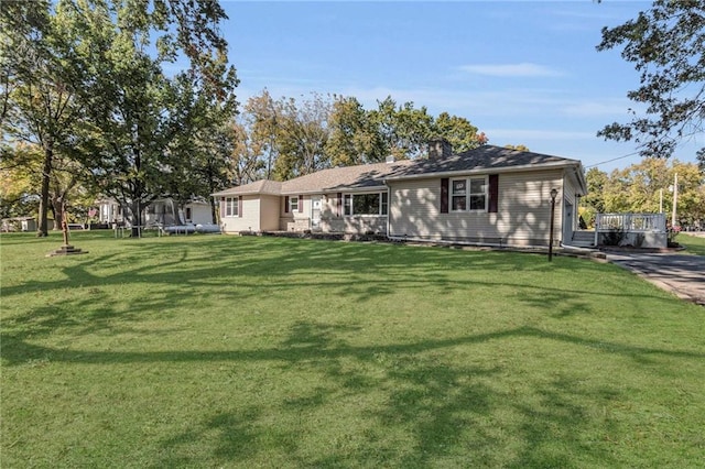 ranch-style home with a front lawn