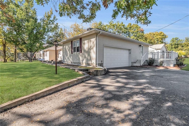 view of home's exterior featuring a yard and a garage