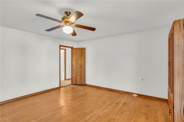 spare room featuring ceiling fan and light hardwood / wood-style flooring