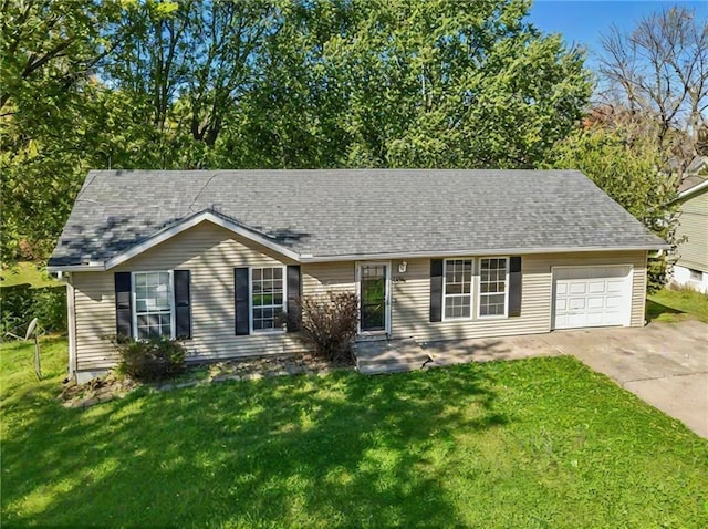 single story home with a garage and a front lawn