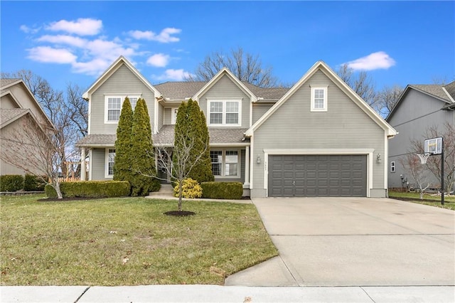 view of front property featuring a garage and a front lawn