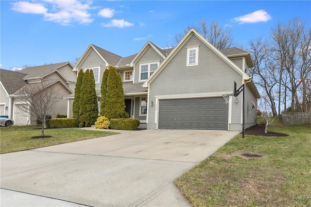 front of property with a front lawn and a garage