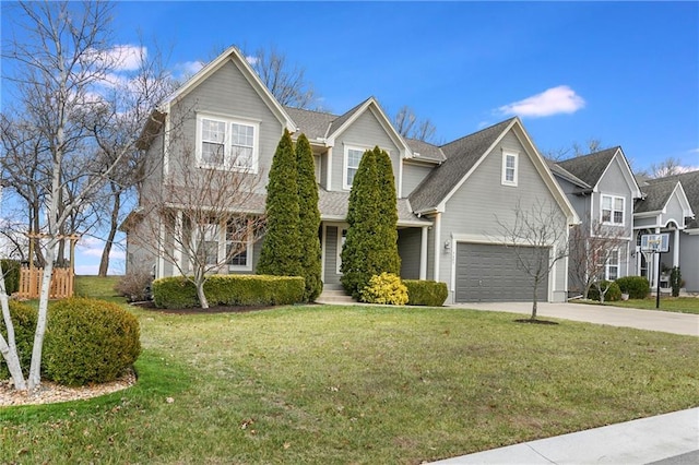 view of front property featuring a garage and a front lawn