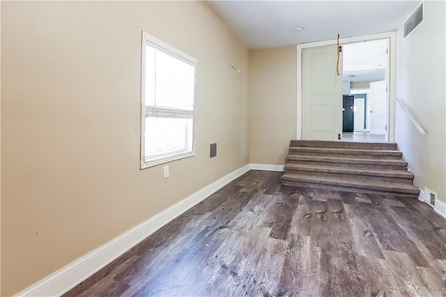 stairs with wood-type flooring