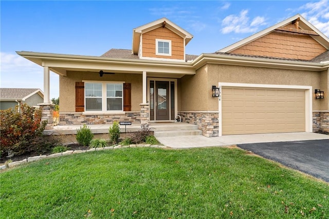 craftsman house with a front lawn, a porch, and a garage