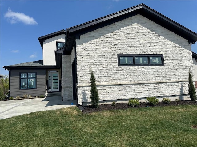 2852 W 133rd Ter, Leawood, KS 66209 - view of property exterior with a lawn and stone siding