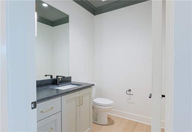 2852 W 133rd Ter, Leawood, KS 66209 - half bath featuring toilet, wood finished floors, vanity, ornamental molding, and baseboards
