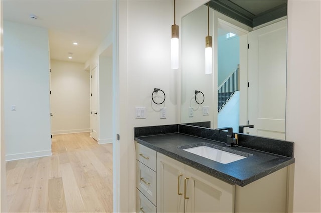2852 W 133rd Ter, Leawood, KS 66209 - bathroom with wood finished floors, vanity, baseboards, and recessed lighting