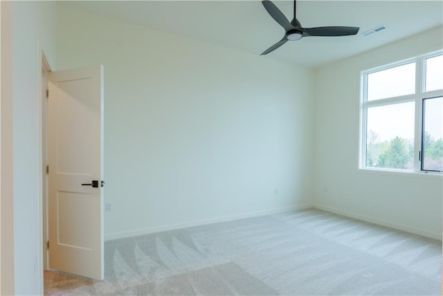 2852 W 133rd Ter, Leawood, KS 66209 - spare room with plenty of natural light, light carpet, a ceiling fan, and baseboards