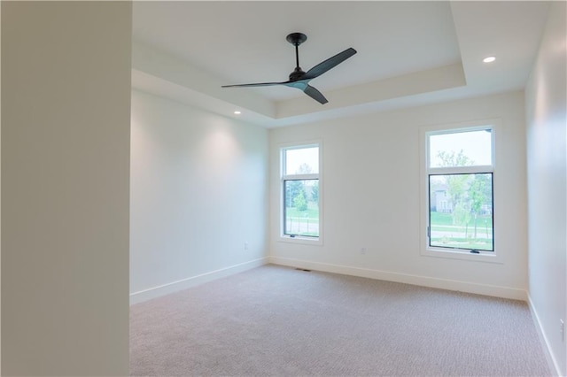 2852 W 133rd Ter, Leawood, KS 66209 - carpeted empty room featuring a tray ceiling, baseboards, a ceiling fan, and recessed lighting