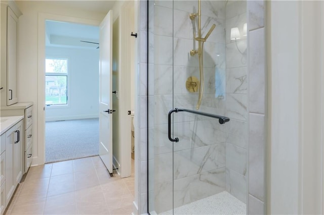 2852 W 133rd Ter, Leawood, KS 66209 - full bathroom featuring a stall shower, vanity, toilet, tile patterned floors, and baseboards