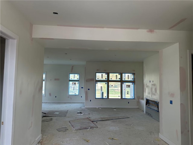 2852 W 133rd Ter, Leawood, KS 66209 - unfurnished living room featuring a glass covered fireplace