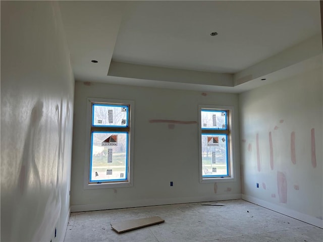 2852 W 133rd Ter, Leawood, KS 66209 - unfurnished room featuring plenty of natural light, a tray ceiling, and baseboards