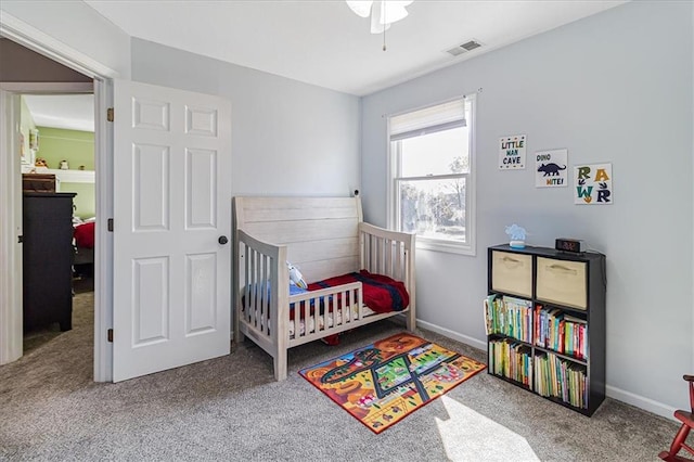 bedroom with carpet and a nursery area