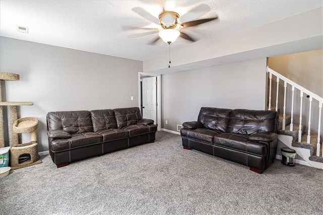 carpeted living room featuring ceiling fan