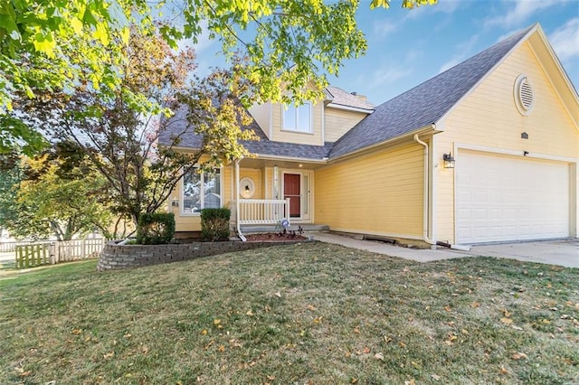 view of front of house with covered porch, a front yard, and a garage