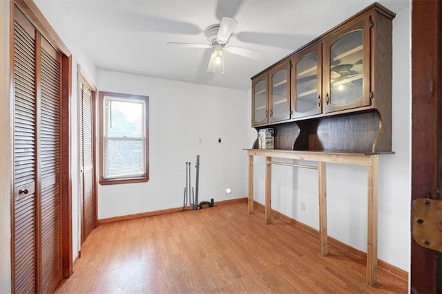 interior space with light wood-type flooring and ceiling fan