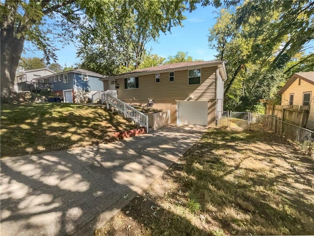 rear view of house featuring a garage