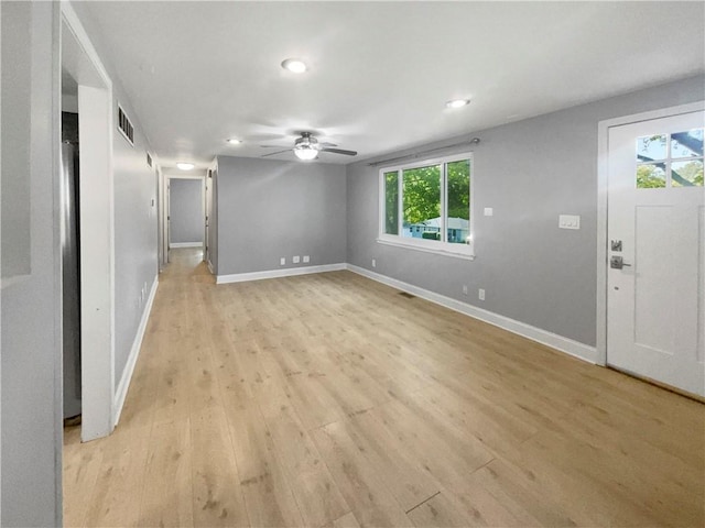 interior space featuring light hardwood / wood-style flooring, ceiling fan, and plenty of natural light