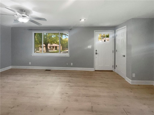 entrance foyer with light hardwood / wood-style flooring, a healthy amount of sunlight, and ceiling fan