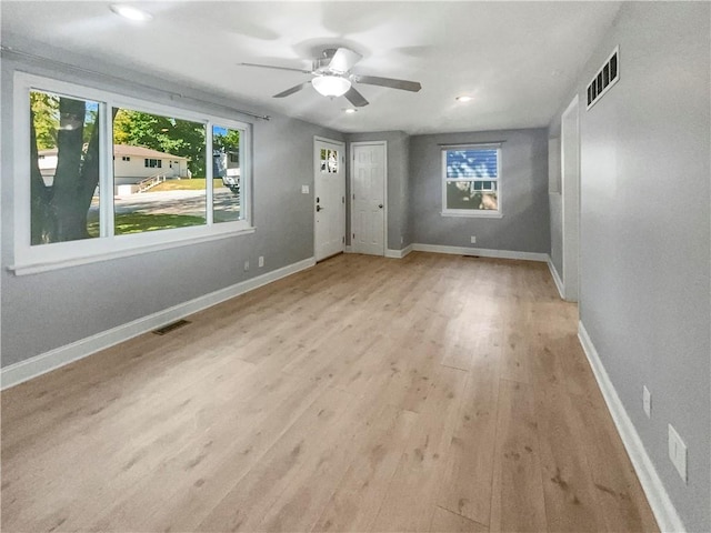 interior space featuring light wood-type flooring and ceiling fan