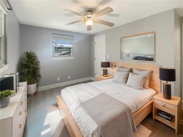 bedroom with wood-type flooring and ceiling fan