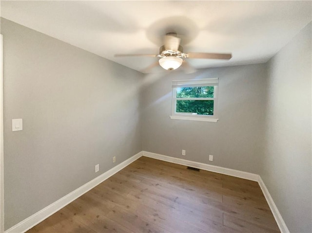 unfurnished room featuring hardwood / wood-style flooring and ceiling fan