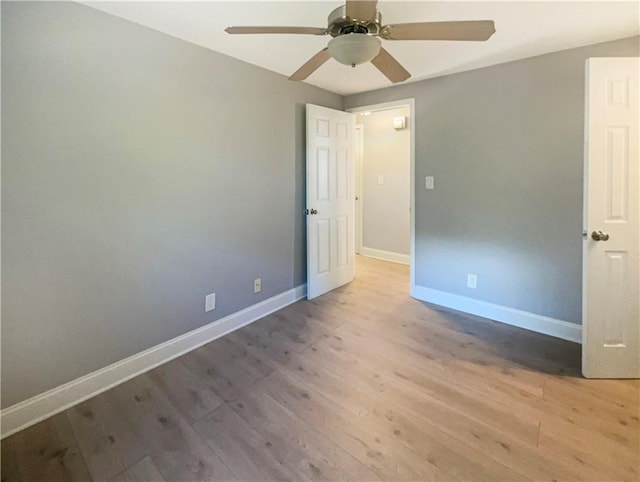 unfurnished bedroom featuring hardwood / wood-style flooring and ceiling fan