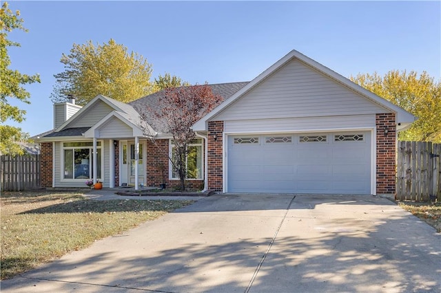 single story home featuring a garage and a front lawn