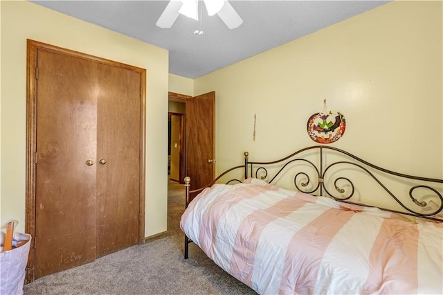 bedroom featuring a closet, ceiling fan, and carpet