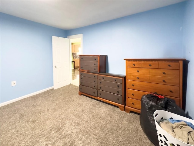 bedroom featuring light colored carpet