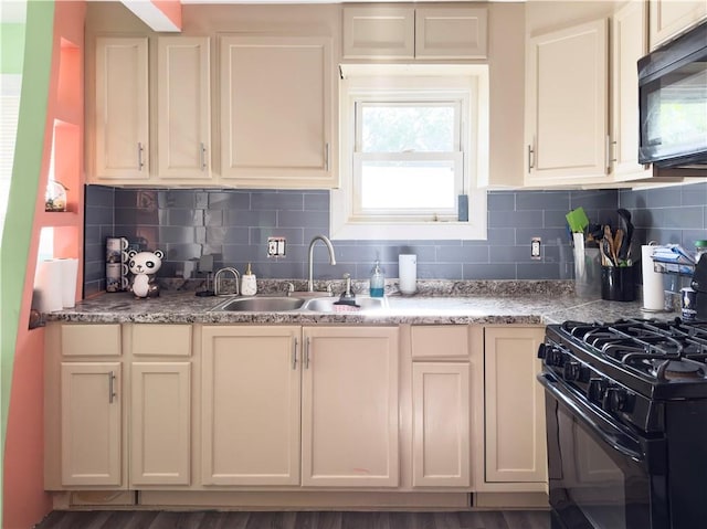 kitchen featuring black appliances, wood-type flooring, and backsplash