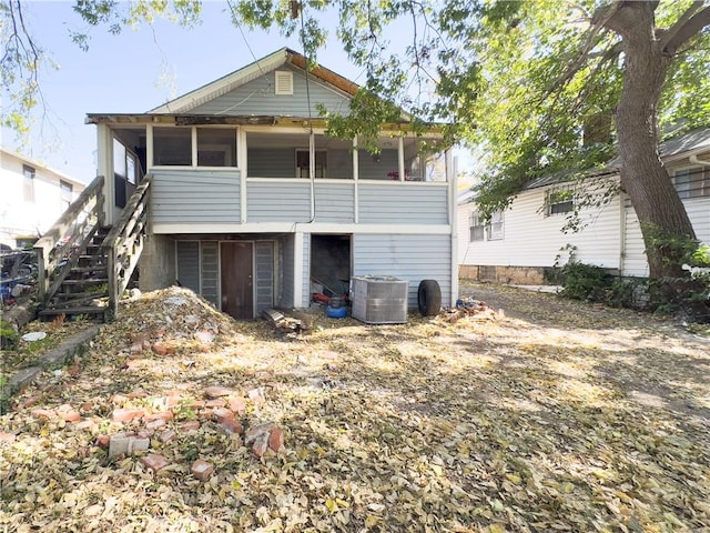 rear view of property featuring central air condition unit